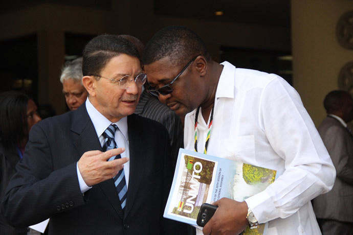 Tourism and Hospitality Minister Engineer Walter Mzembi chats with UNWTO Secretary General Mr Taleb Rifai