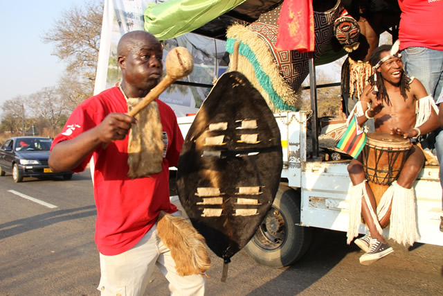 Lovemore Moyo member of the Horn of Africa group perform during a street carnival in Victoria Falls.
