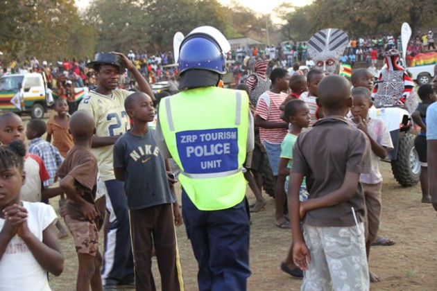 A Police officer patrols Chinotimba stadium.