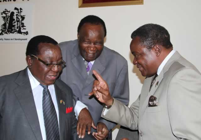 Zanu-PF national chairman Cde Simon Khaya Moyo (left), political commissar Cde Webster Shamu (right) and Politburo member Cde Josiah Hungwe chat during a meeting of election team leaders at the party headquarters in Harare yesterday