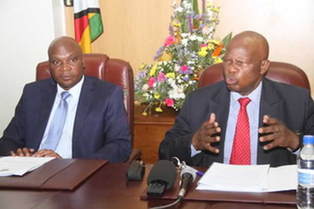 Mines and Mining Development Minister Walter Chidhakwa (left) and his Finance counterpart Cde Patrick Chinamasa address journalists on gold mining in Harare yesterday