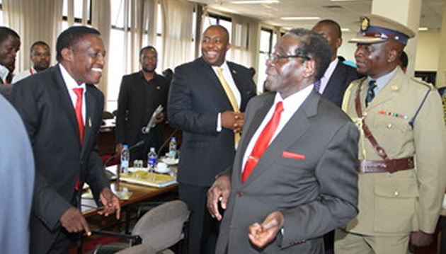President Mugabe jokes with Cde Absolom Sikhosana on arrival for a Politburo meeting at Zanu-PF Headquarters in Harare yesterday. The President chides him for losing the Central Committee elections as Cde Saviour Kasukuwere joins in the exchange 