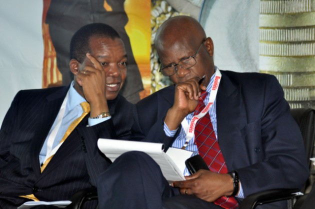 RBZ Governor Dr John Mangudya talks to Finance Minister Patrick Chinamasa during the breakfast meeting this morning.