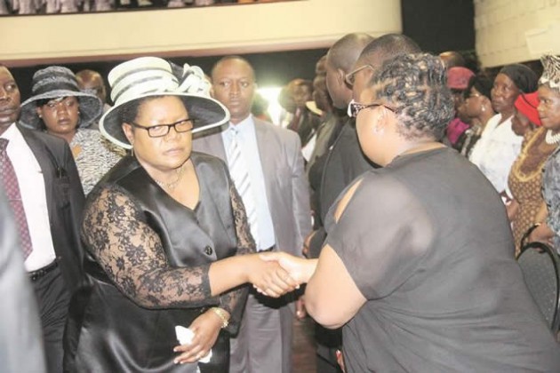Mai Mujuru consoling the Dube family
