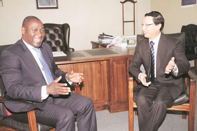 Information Communication Technology, Postal and Courier Services Minister Supa Mandiwanzira speaks to outgoing Chinese Ambassador to Zimbabwe Mr Lin Lin in Harare yesterday
