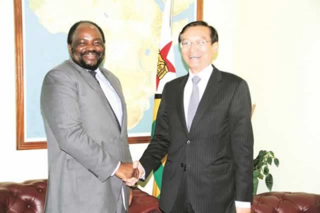 Foreign Affairs Minister Simbarashe Mumbengegwi (left) greets Honourable Zhang Ming, who is leading a Chinese delegation currently in the country to strengthen cooperation between the two countries, in Harare yesterday 