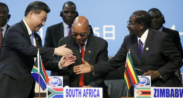 President Mugabe shakes hands with Chinese President Xi Jinping (left) while South African President Jacob Zuma looks on during the Forum on China-Africa Cooperation in Sandton, South Africa, yesterday. — Reuters