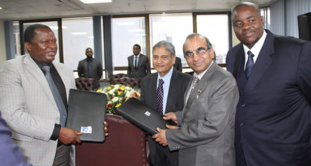 ZPC managing director Eng Noah Gwariro (left) and BHEL general manager Mr Shri Vijay Ramacharyulu hold the signed contract documents for the Gairezi hydro power project while Intratrek Zimbabwe managing director Mr Wicknell Chivayo (right) and Angelique International senior vice president Mr Anil Gupta look on
