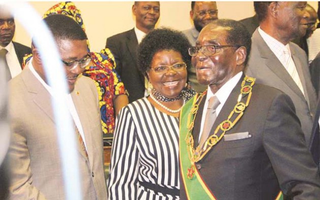 President Mugabe greets Small and Medium Enterprises Development Minister Sithembiso Nyoni and Tourism and Hospitality Industry Minister Dr Walter Mzembi at the official opening of the Fourth Session of the Eighth Parliament in Harare yesterday. — (Picture by Tawanda Mudimu)