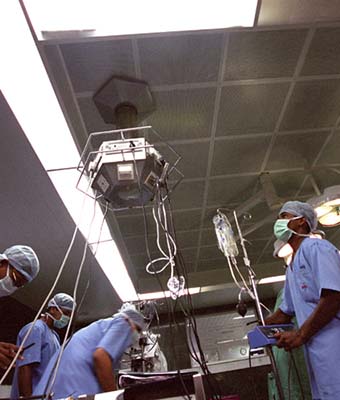 Surgeons in the operating theatre at a hospital in Bangalore, India. — Panos/B Lawley