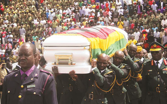 Pall bearers carry the casket bearing the body of national hero Brigadier-General James Murozvi to its final resting place at the National Heroes Acre at a funeral attended by thousands of people in Harare yesterday. — (President’s speech in full on Page 4). — (Picture by Munyaradzi Chamalimba)