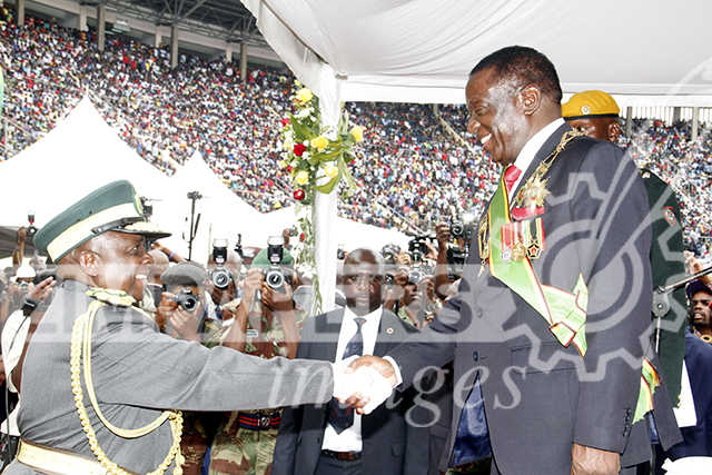 President Emmerson Mnangagwa being congratulated by Zimbabwe Prisons and Correctional Services Commissioner General Paradzai Zimondi soon after his inauguration in Harare this afternoon. Picture by John Manzongo