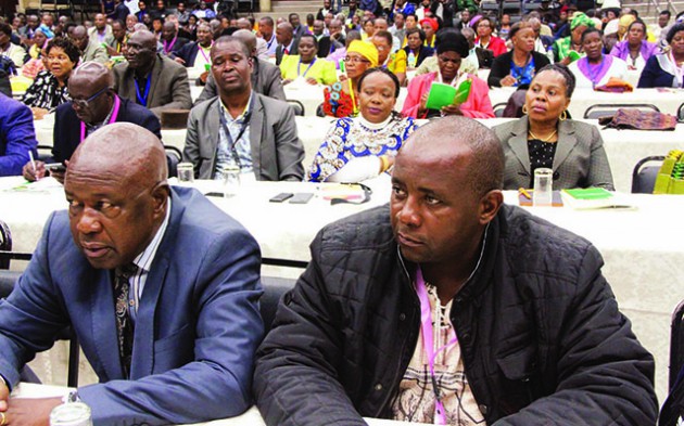 Zimbabwe National Liberation War Veterans’ Association chairperson Cde Christopher Mutsvangwa (left), Ziliwaco national chairman Cde Pupurai Togarepi (right)follow proceedings during a Zanu-PF Central Committee meeting in Harare yesterday. Behind them are Cde Auxillia Mnangagwa (second right) and Central Committee member Monica Mutsvangwa (right) and other members — Picture by Memory Mangombe