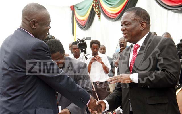 President Emmerson Mnangagwa congratulating Minister of Lands, Agriculture and Rural Resettlement, Air Marshal Perrance Shiri after swearing in ceremony at state house recently. Picrture by John Manzongo