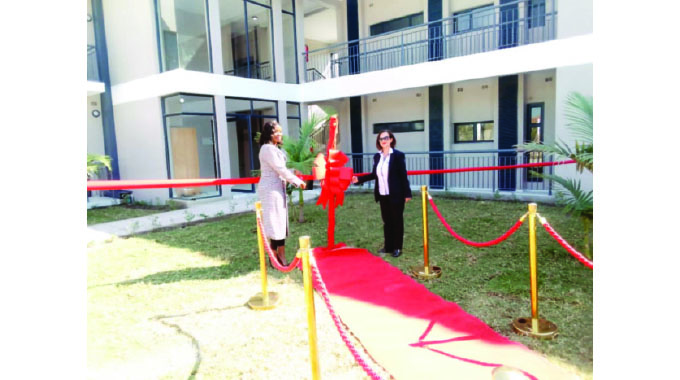 24 families move into upmarket apartments