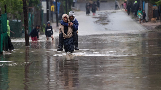 Climate change blamed as  record rains f...